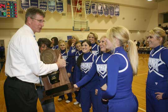 Bryant High School principal Randy Rutherford accepted several of the trophies earned by those honored on Tuesday night including the State championship and national awards earned by the Bryant varsity dance team. (Photo by Rick Nation)