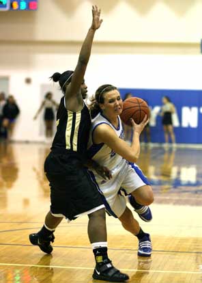Bryant's Kenzee Calley tries to drive past a Little Rock Central defender. (Photo by Rick Nation)