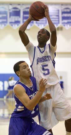 K-Ron Lairy (5) shoots over Conway's Teshawn Sims. (Photo by Rick Nation)