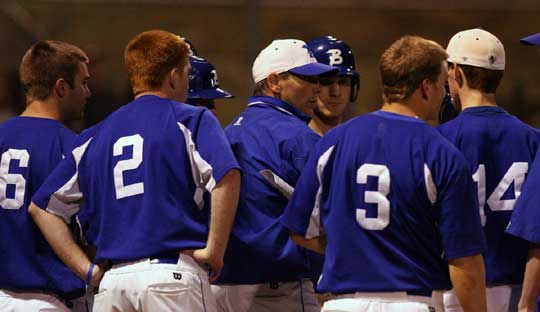 Bryant head coach Kirk Bock gathers his team between innings. (photo by Rick Nation)