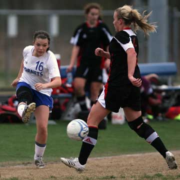 Bryant's Erica Selig (16) tries to drive past a Russellville player. (Photo by Rick Nation)