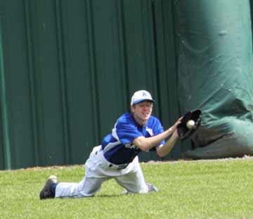 Caleb Garrett makes a diving catch in right for the Hornets. (Photo by Phil Pickett)