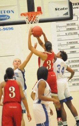 Bryant's Alana Morris (34) and Abbi Stearns try to defend Northside's Mannasha Bell. (Photo by Kevin Nagle)