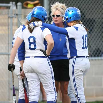 Bryant head coach Debbie Stepp huddles with Jessie Taylor (8), Cassidy Wilson (10) and Peyton Jenkins. (Photo by Rick Nation)