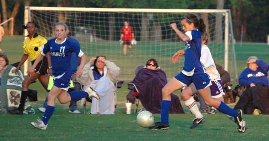 Makenzie Adams pushes the ball upfield for Bryant. (Photo by Mark Hart)