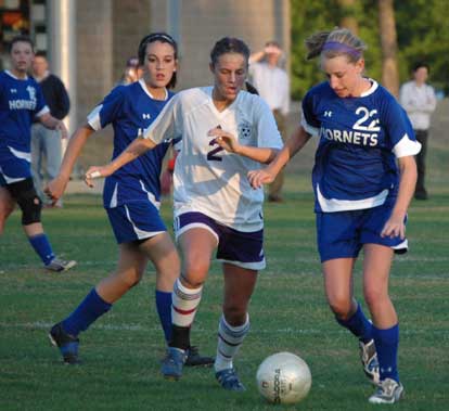 Lindsey Brazil (22) and Lexie Balisterri contend with a Mount St. Mary player for possession during a game earlier this season. (Photo by Mark Hart)