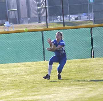 Kelsie Works charges in to make a catch in center field during Thursday's game at North Little Rock. (Photo by Kevin Nagle)