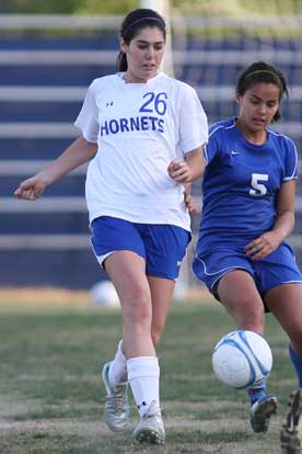 London Abernathy (26) battles for possession in a game earlier this season. (Photo by Rick Nation)