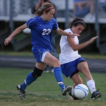 Bryant's Lexie Balisterri, right, battles a Conway player for possession. (Photo by Rick Nation)
