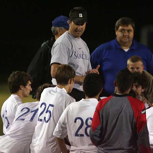 Hornets coach Jason Hay meets with his team after their 3-0 win over Conway Tuesday. (Photo by Rick Nation)