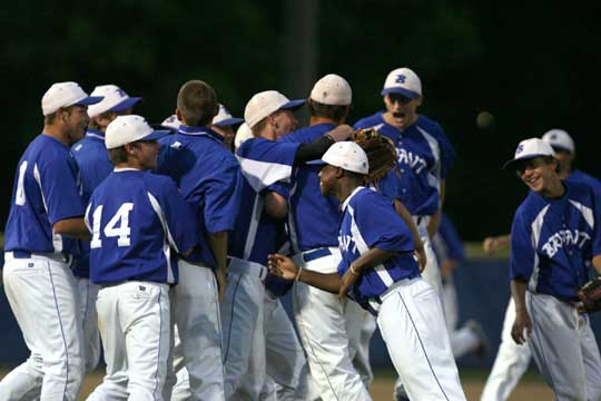 Ben Wells is greeted by his teammates after completing Monday's game against Van Buren. (Photo by Rick Nation)
