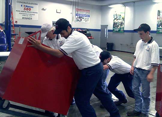 The Saline County Career Center crew helps clean up after Saturday's competition at Mark Martin Ford in Batesville.