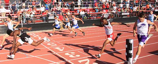 Caleb Thomas and Tanner Tolbert, center, finished 4th and 6th, respectively, in the 100. (Photo by Carla Thomas)