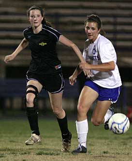 Shelby Gartrell (8) races a Central player to get to a loose ball. (Photo by Rick Nation)