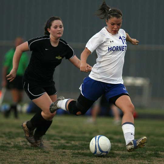 Erica Selig (16) kicked in Bryant's goal during Tuesday's match. (Photo by Rick Nation)