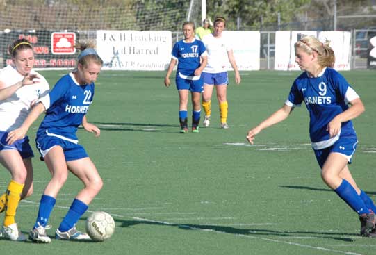 Lindsey Brazil (22), Tarra Hendricks (17) and Maggie Hart (9). (Photo by Mark Hart)