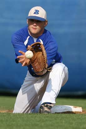 Bryant first baseman Brady Butler takes a throw during Monday's game. (Photo by Rick Nation)