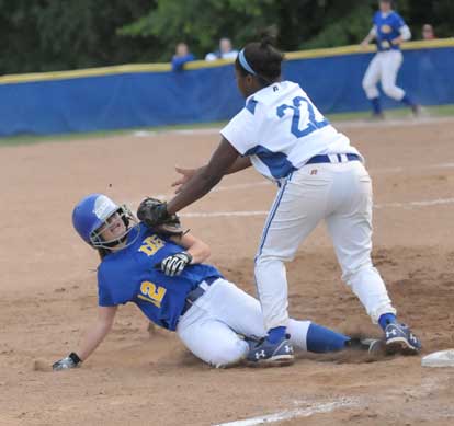 Bryant's Shanika Johnson tags out a North Little Rock player on a play at third. (Photo by Kevin Nagle)