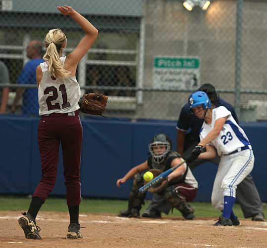 Benton's Lauren White (21) delivers a pitch to Bryant's Ashley Chaloner (23). (Photo by Rick Nation)