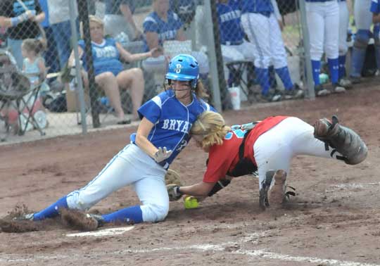 Bryant's Ashley Chaloner appears to slide past the tag of Fort Smith Southside catcher Madi Jordan during the second inning of Monday's State tourney game. Chaloner, however, was called out on the play. (Photo by Kevin Nagel)