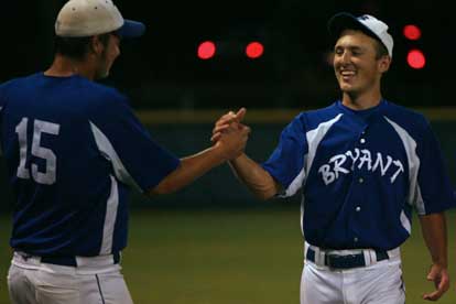 Ben Wells, left, and Blake Davidson shake hands after combining on a three-hit shutout Monday night. (Photo by Rick Nation)
