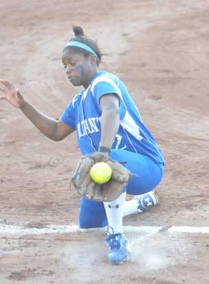 Shanika Johnson backhands a foul grounder outside of third base. (Photo by Kevin Nagel)