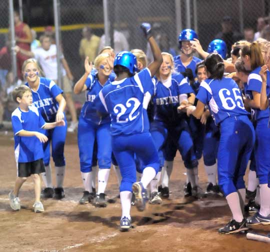 Senior Shanika Johnson (22) is greeted by her teammates after her sixth-inning home against Cabot Tuesday night. (Photo by Kevin Nagel)