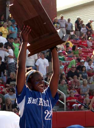 Bryant senior Shanika Johnson holds up the State championship trophy in triumph after accepting it on behalf of the Lady Hornets team. (Photo courtesy of Phil Pickett)