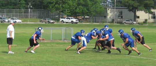 Defensive coordinator Steve Griffith observes the work of his linebackers.