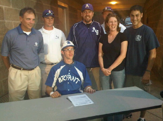 Bryant coach Kirk Bock, Arkansas Baptist coaches and his parents joined B.J. Ellis as he signed a letter of intent to continue his career and education at Arkansas Baptist College.