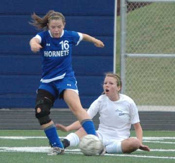 A Fort Smith Southside player expresses her surprise after Bryant's Erica Selig (16) took the ball from her during Saturday's match. (Photo by Mark Hart)