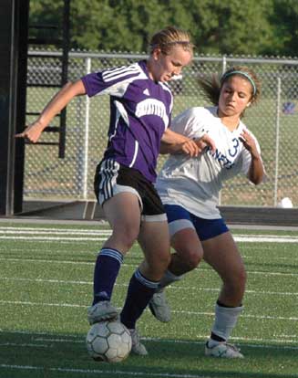 Bryant's Sarenity Gomez (3) attempts a steal. (Photo by Mark Hart)