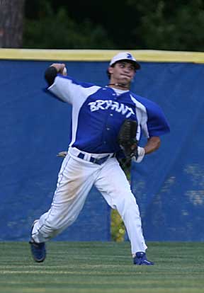 Bryant center fielder Garrett Bock fires a throw toward the infield after fielding a drive into the gap on Tuesday. Bock had two hits and four RBIs at the plate in the game. (Photo by Rick Nation)