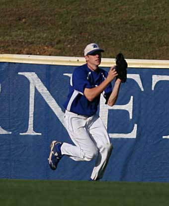 Caleb Garrett brings in a fly to right. (Photo by Rick Nation)