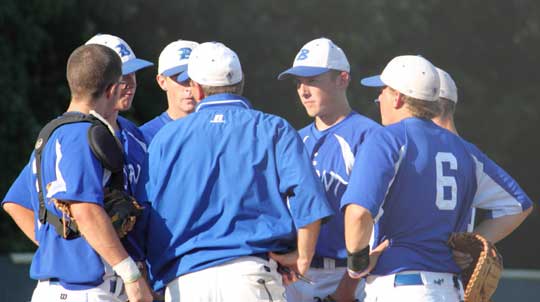 Bryant head coach Kirk Bock talks with his infield and battery early in Thursday's game at Cabot. (Photo by Phil Pickett)