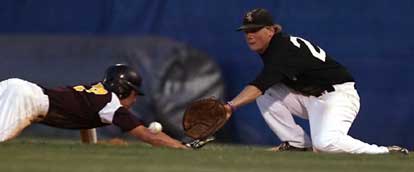 Bryant's Brady Butler, right, takes a pickoff throw at first. (Photo by Rick Nation)