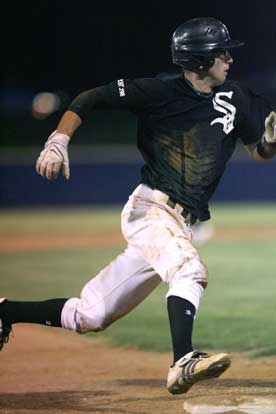 B.J. Ellis rounds third and heads for home. (Photo by Rick Nation)