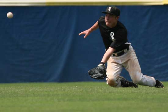 Chris Joiner charges in from center field to try to catch in shallow fly during Sunday's second game against Texarkana. (Photo by Rick Nation)