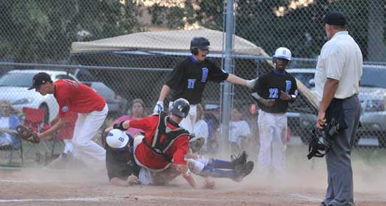 Bryant's Riley Hall upends the White Hall catcher as he slides home safely during Bryant's six-run seventh. (Photo by Ron Boyd)