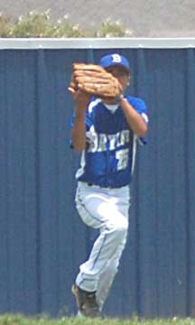 Chris Troillett hauls down a flyball in right during Friday's game.