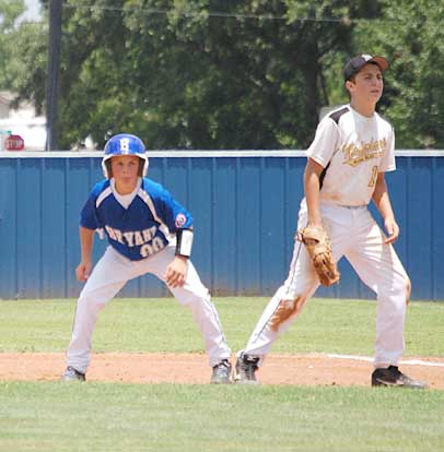 Korey Thompson, left, leads off first.