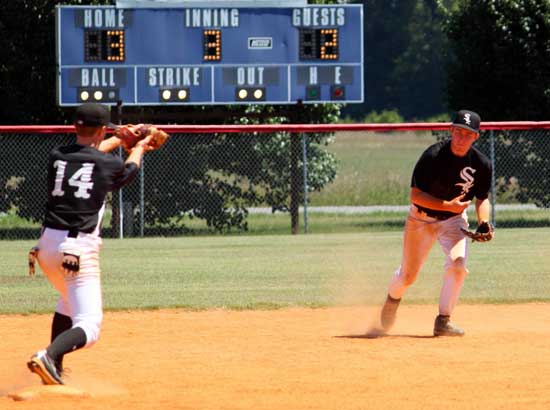 Lucas Castleberry, right, tosses to shortstop Jordan Taylor for a force at second during Friday's game. (Photo by Phil Pickett)