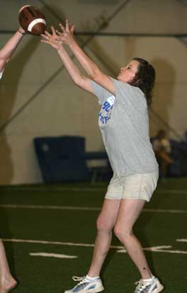 Valerie Lowry hauls in a pass over a defender's outstretched hands. (Photo by Rick Nation)