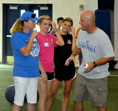 Coach Dale Jones gives a group of Mommies instructions. (Photo by Kevin Nagle)