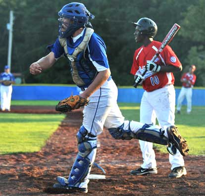 Bryant catcher Blaine Jackson whips a throw to third. (Photo courtesy of Ron Boyd)