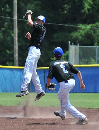Tyler Nelson leaps to grab a liner in front of teammate Evan Castleberry. (Photo courtesy of Ron Boyd)