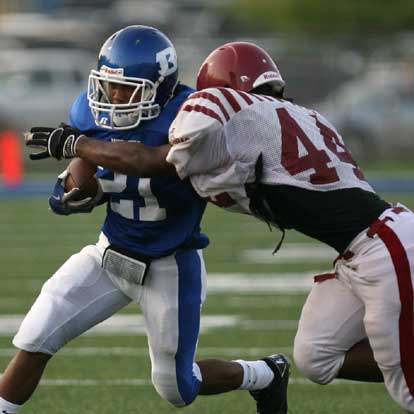 Bryant sophomore Jalen Bell (21) breaks past a Pine Bluff tackler. (Photo by Rick Nation)