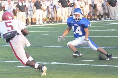 Bryant's Caleb Thomas (14) pursues a Pine Bluff back. (Photo by Kevin Nagle)
