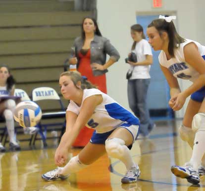 Jordan Francis (5) digs up a ball in front of teammate Brooke Howell. (Photo by Kevin Nagle)