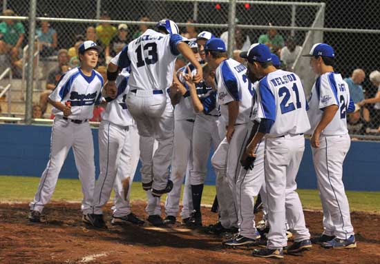Bryant's Blain Jackson (13) is greeted by his teammates after his second home run on Tuesday night. (Photo by Ron Boyd)